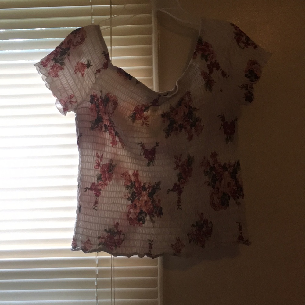 Red and white blouse with flowers on it